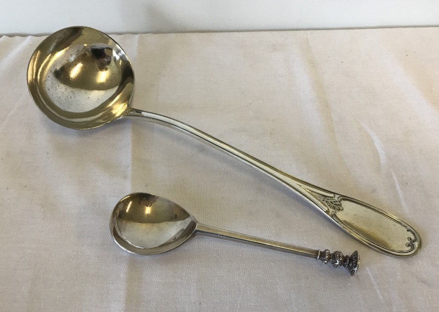 An Art Nouveau silver plated soup ladle and spoon.