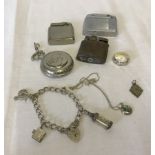 A small collection of silver jewellery and lighters.