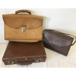 A 1940's leather handbag together with a pale leather vintage briefcase and one other briefcase.