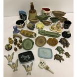 A box of assorted Wade ceramics.