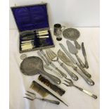 A box of silver and silver plated items.