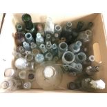 A box of assorted glassware jars and bottles.