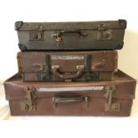 3 vintage suitcases.