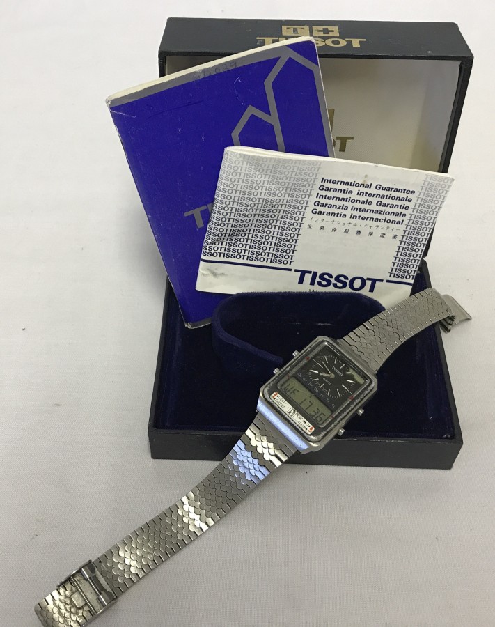 A vintage Tissot digital men's watch with original box and paperwork.