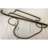 A vintage riding crop, a combined crop/pony & trap whip, and a walking stick.