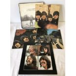 4 Beatles albums together with a George Harrison box set album.