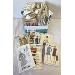 A box of vintage ladies clothing patterns from 1950's - 1980's.