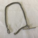 A hallmarked silver albert watch chain with T bar and clip fastening.
