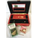 A red leather jewellery box containing a 9ct gold pin brooch, costume jewellery and a ladies watch.