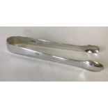 A pair of Georgian silver sugar tongs.