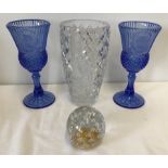 A heavy cut crystal clear vase together with 2 blue moulded glass goblets and a paperweight.