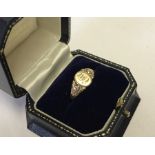 A yellow gold ladies signet ring marked 10k.