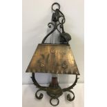 A copper hanging ceiling light.