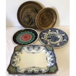 A collection of plates, plaques and chargers.