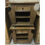 A pair of oak coffee/side tables with drawer & magazine racks to side.