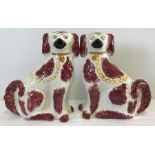 A pair of large Staffordshire flat back ceramic fire dogs.