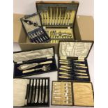 A quantity of assorted boxed cutlery sets.