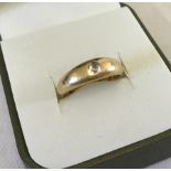 An 18ct diamond & gold ring.