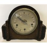 A wooden cased Westminster chime Art Deco mantle clock with key and pendulum.