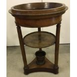 A Victorian mahogany circular wine cooler stand.