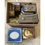 A box of vintage biscuit tins.