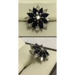 An 18ct white gold sapphire & diamond cluster ring.