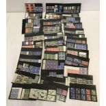 A collection of mint/unused vintage British stamps on 37 stamp display cards.