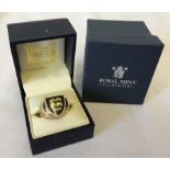 A boxed 9ct gold Royal Mint Three Lions of England gents signet ring.