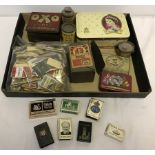 A tray of assorted items to include vintage matchbox holders, Coronation tins and vintage OXO tins.
