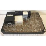 A box of assorted glasses and glassware items.