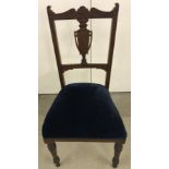 An Elizabethan style chair with blue velvet upholstery.