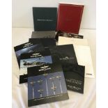 A quantity of watch catalogues to include Breitling, Cartier and Longines.