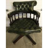 A c1960's green leather Captain's chair.