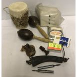 A box of assorted musical items to include maracas, Yehudi Menuhin chin rest and tuning forks.