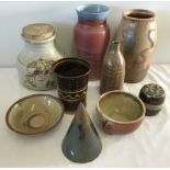 A box of assorted signed and unsigned items of studio pottery.