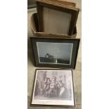 A box of large framed prints and pictures.