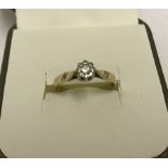 A 9ct yellow gold illusion set diamond solitaire ladies ring.