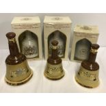 6 empty Bell's whiskey decanters by Wade.