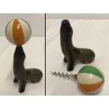 A vintage Wade Seal balancing a ball novelty corkscrew.