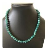 A green bead necklace.