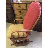 A Dutailier (USA) gliding rocking chair.