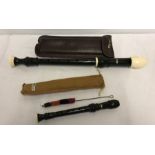 2 cased Aulos recorders.