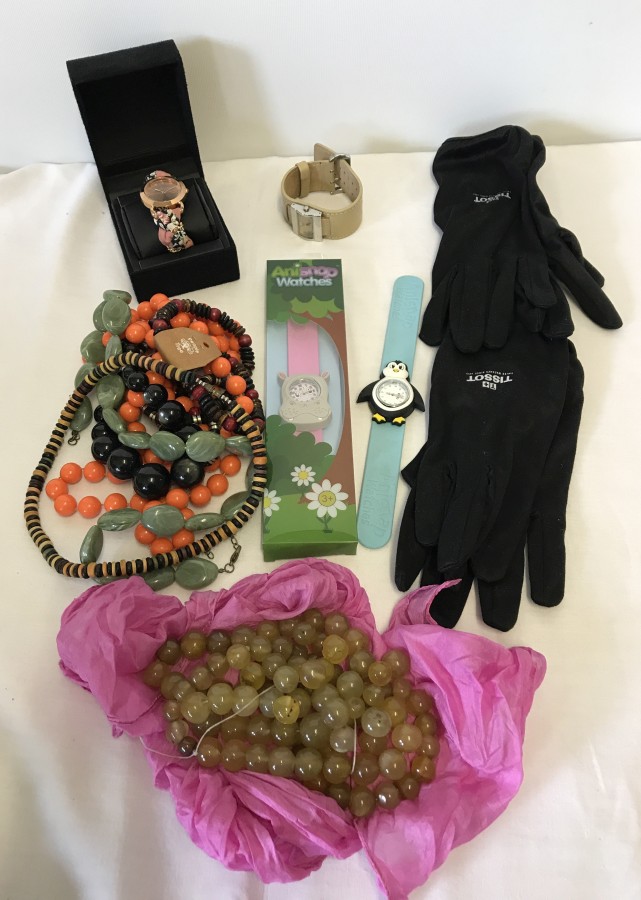 A box of mixed beads and watches to include children's Anisnap watches.