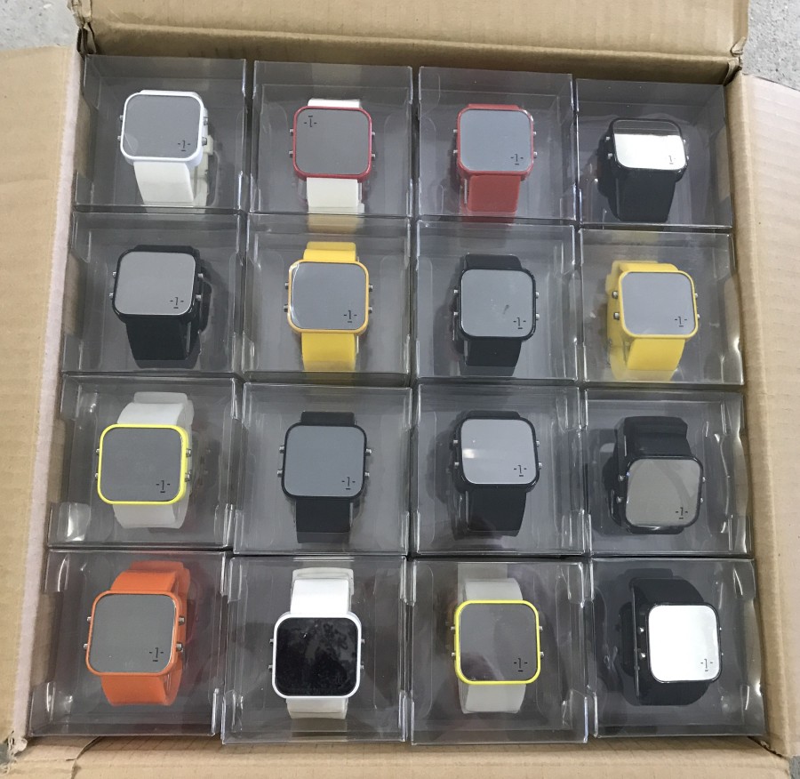 A box of 64 new 1: Face digital touch screen watches. Individually boxed.