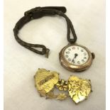 Scrap gold - a 9ct gold Mizpah brooch (no pin), with a 9ct gold cased ladies watch (not working).