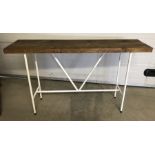 A custom made console table with white metal base and 40mm driftwood top. Rrp £ 350.