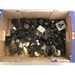 A box of vintage electrical plugs and fittings.