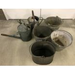 4 galvanised buckets and 2 watering cans.