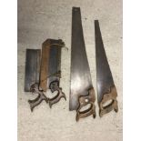 4 vintage wooden handled saws.