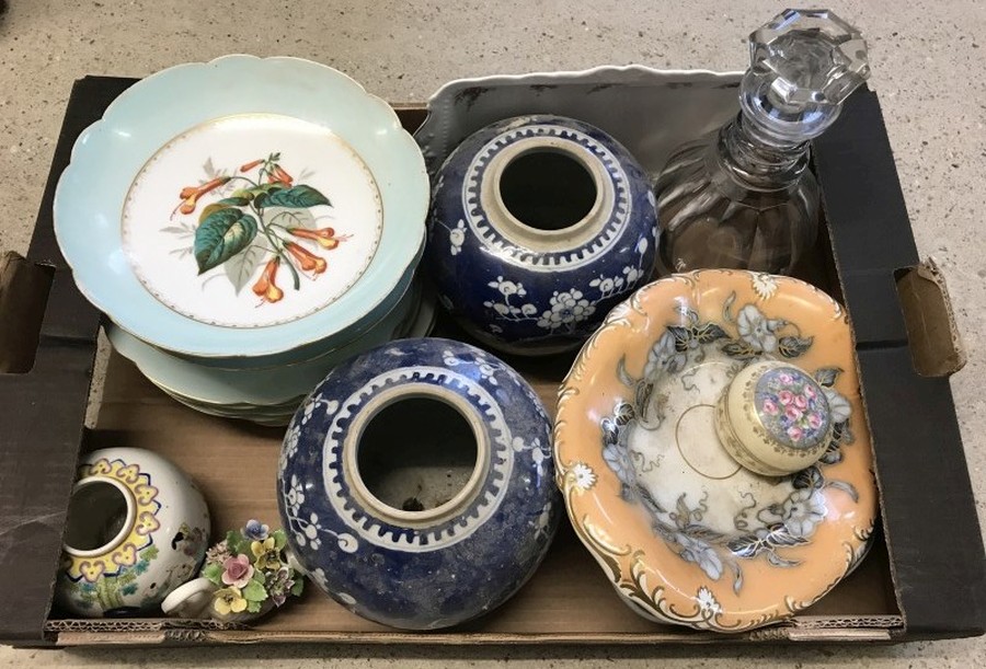 A box of assorted ceramics and glass.